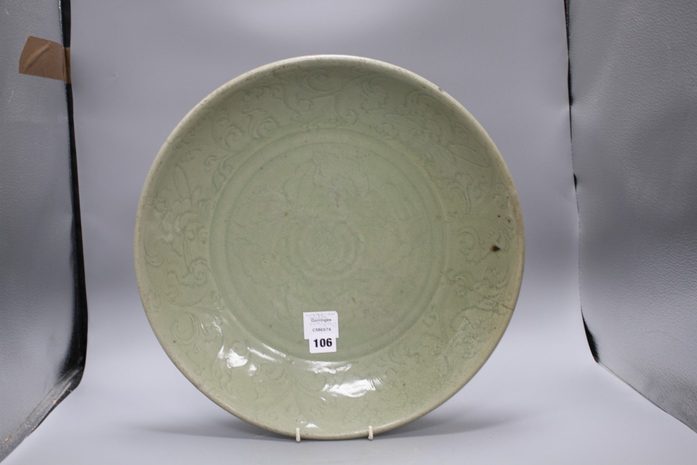 A 15th / 16th century Longquan celadon dish, incised with flowers, diameter 43cm, height 8.5cm